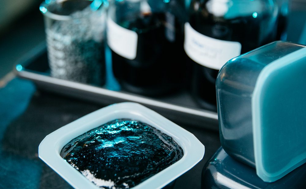 Close-up of CanaPux and jars of bitumen