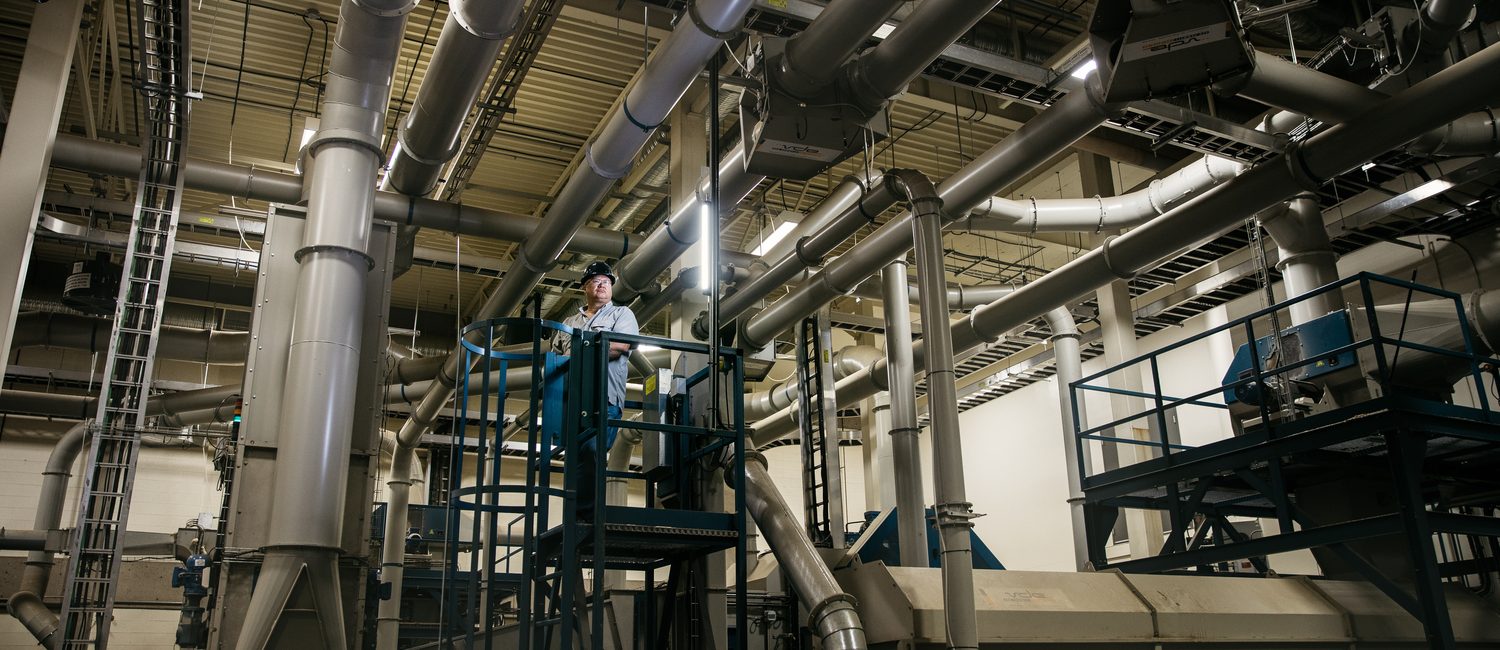Man standing in industrial facility