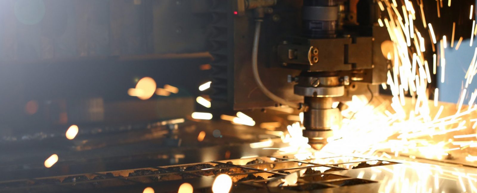 Sparks fly out machine head for metal processing