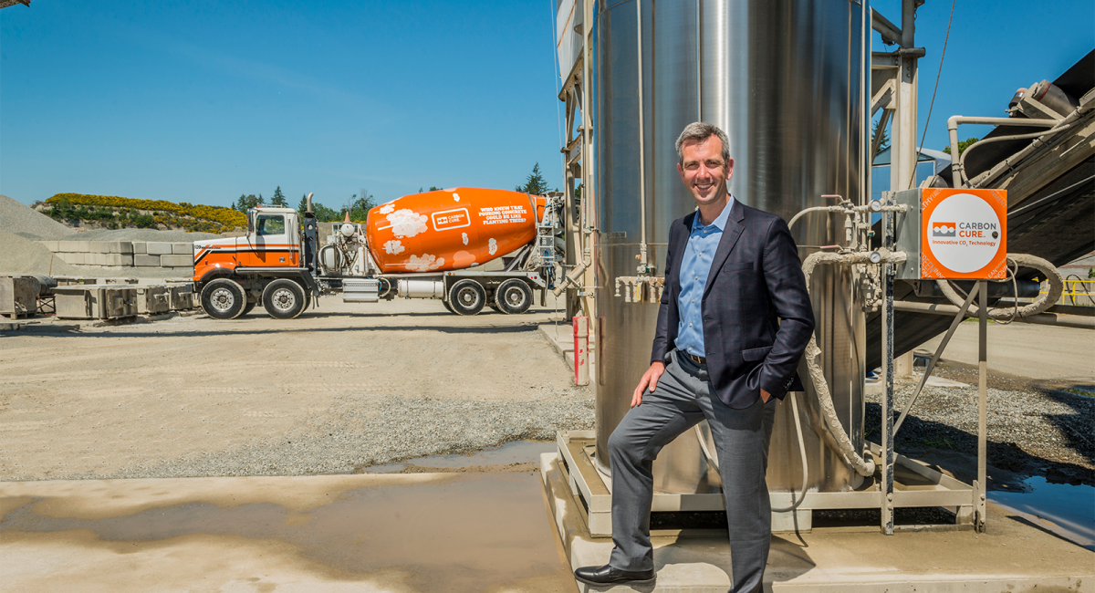CEO Rob Nicen stands alongside a CarbonCure truck and valve box
