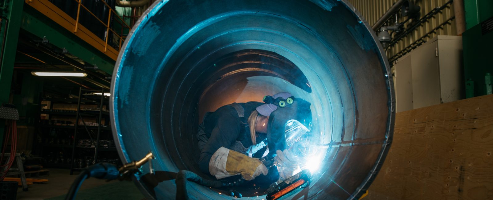 InnoTech worker welding inside a pipeline.