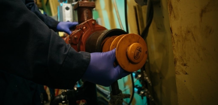 An InnoTech Alberta employee working on the pigging flow loop,